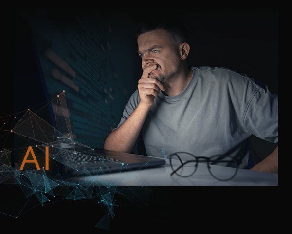(image: Man looking at his computer)